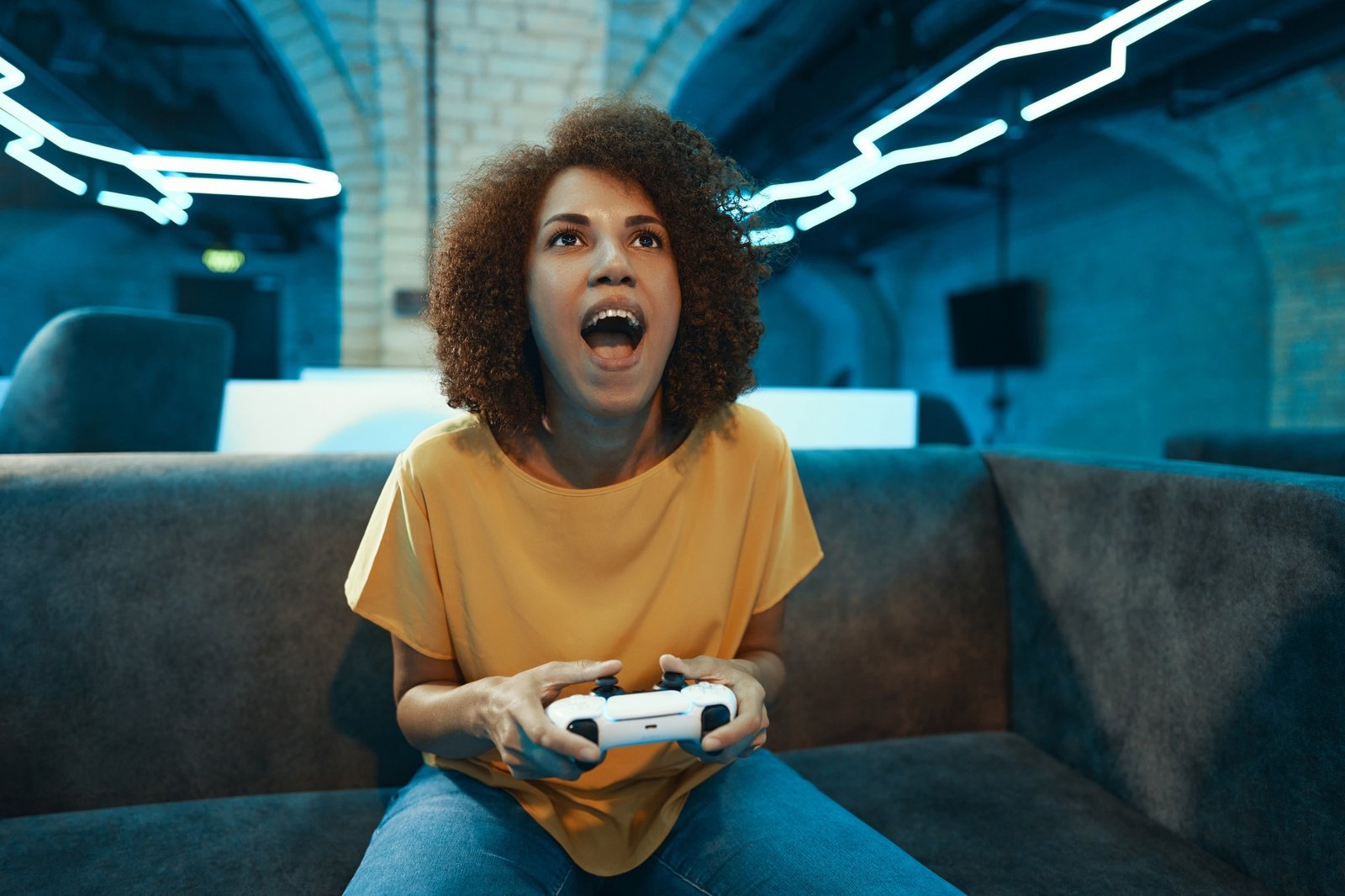 A young cyber gamer girl plays rpg games and shooters.