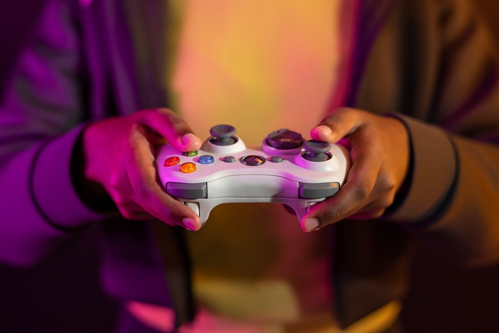 Hand playing video game using a game console entertainment technology